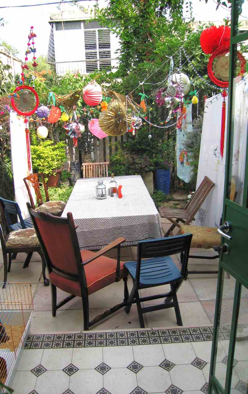 A very small garden, yet – because of smart planning, there is enough room for a sukkah   