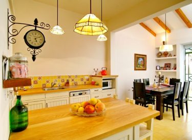 kitchen with island, dining table in the background