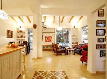 open space with living room, dining table, and kitchen