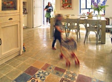 the entrance with the colorful tiles, looking to the direction fo the dining room and kitchen