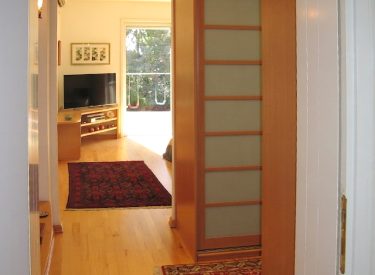 master bedroom entryway. Featuring a walk-in wardrobe on the right and a dedicated niche for a mirror on the left