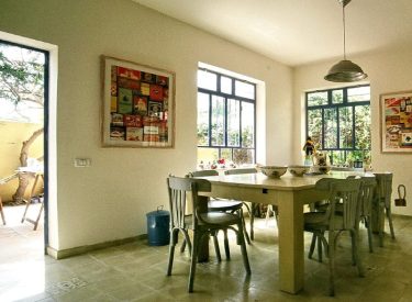 the dining room - warm, colorful, with large windows