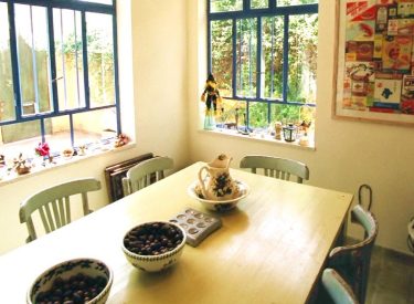 the dining room - warm, colorful, with large windows